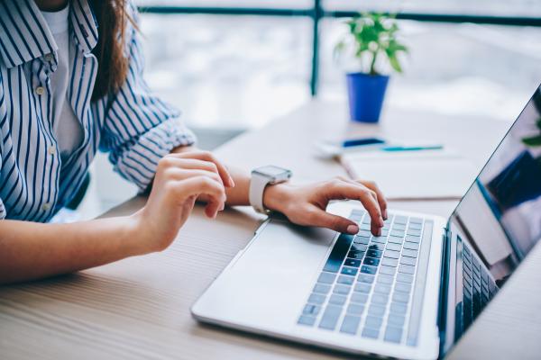 Woman typing on laptop
